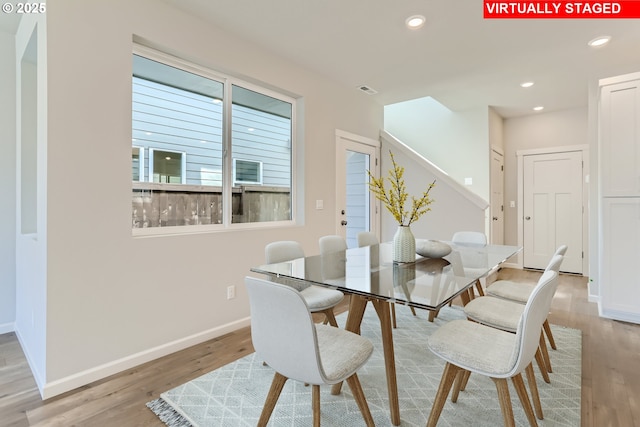 31709 NW Turel Dr, North Plains, OR 97133 - dining area featuring visible vents, baseboards, light wood finished floors, recessed lighting, and stairs