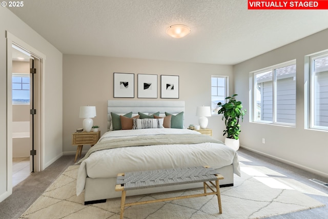 31709 NW Turel Dr, North Plains, OR 97133 - bedroom with visible vents, multiple windows, a textured ceiling, and carpet