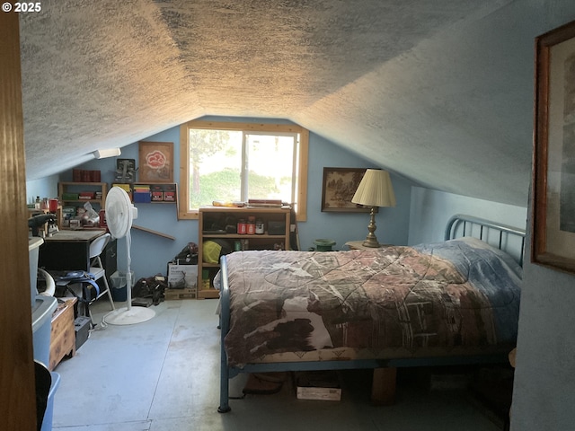 39798 Bear Gulch Rd, Sumpter, OR 97877 - bedroom with a textured ceiling, lofted ceiling, and concrete flooring