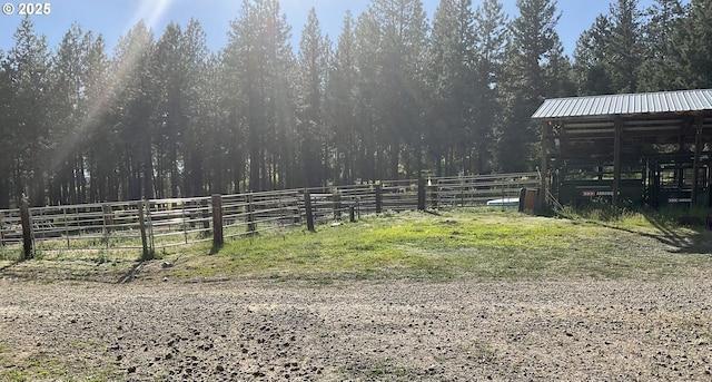 39798 Bear Gulch Rd, Sumpter, OR 97877 - view of yard with an outbuilding and a forest view