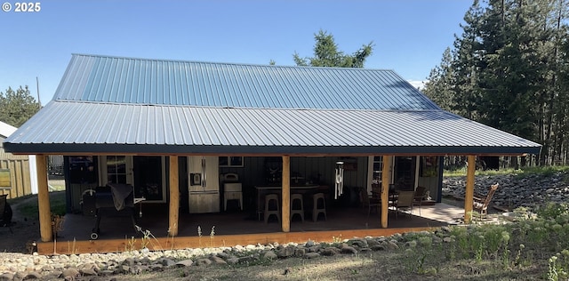 39798 Bear Gulch Rd, Sumpter, OR 97877 - rear view of house featuring a metal roof and a patio area