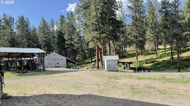 39798 Bear Gulch Rd, Sumpter, OR 97877 - view of yard featuring an outbuilding, a pole building, and a garage