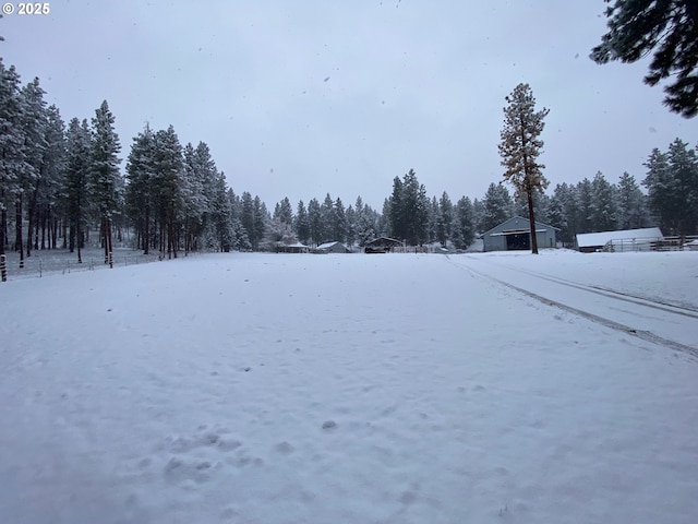 39798 Bear Gulch Rd, Sumpter, OR 97877 - snowy yard featuring a wooded view