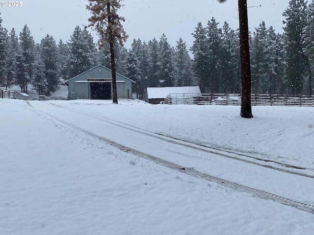 39798 Bear Gulch Rd, Sumpter, OR 97877 - yard layered in snow with an outdoor structure, an outbuilding, and a detached garage