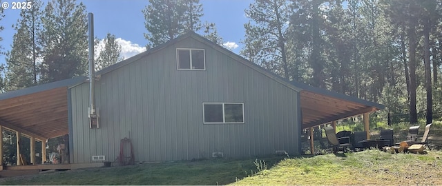 39798 Bear Gulch Rd, Sumpter, OR 97877 - view of side of home featuring a carport and a yard