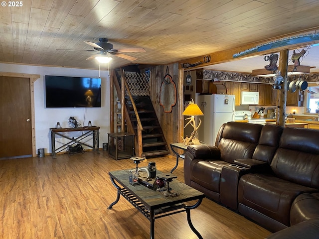 39798 Bear Gulch Rd, Sumpter, OR 97877 - living area featuring ceiling fan, light wood-type flooring, stairs, and wood ceiling