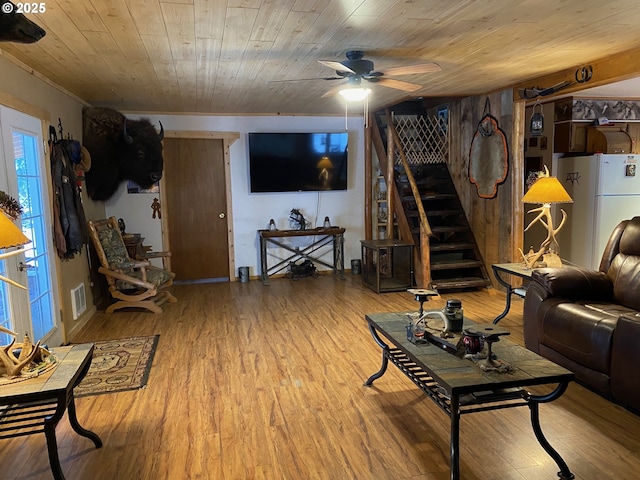39798 Bear Gulch Rd, Sumpter, OR 97877 - living room featuring ceiling fan, light wood-type flooring, and stairs