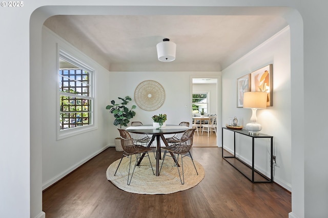 3575 NE Emerson St, Portland, OR 97211 - dining space featuring plenty of natural light, wood finished floors, arched walkways, and baseboards