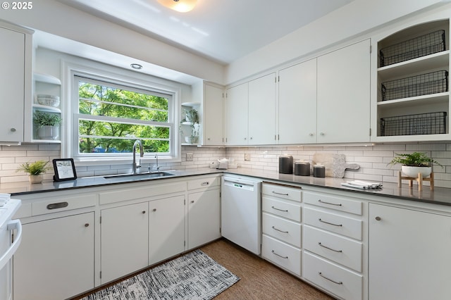 3575 NE Emerson St, Portland, OR 97211 - kitchen featuring open shelves, white dishwasher, a sink, and tasteful backsplash