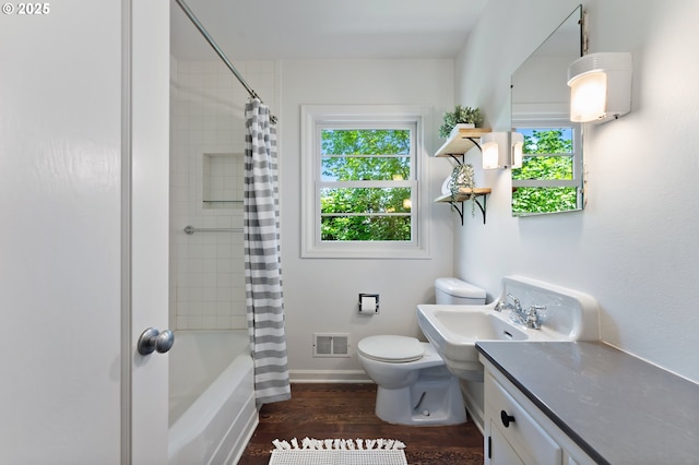 3575 NE Emerson St, Portland, OR 97211 - bathroom with toilet, wood finished floors, shower / bath combination with curtain, vanity, and baseboards