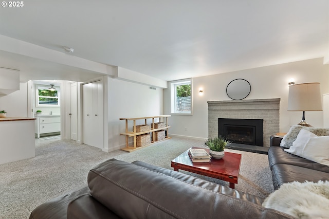 3575 NE Emerson St, Portland, OR 97211 - living area featuring carpet flooring, healthy amount of natural light, and a brick fireplace