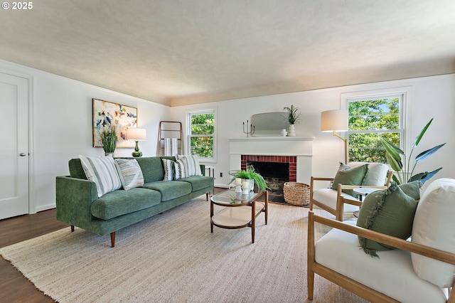 3575 NE Emerson St, Portland, OR 97211 - living room featuring wood finished floors, a fireplace, and baseboards