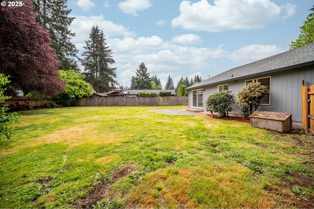 view of yard featuring a fenced backyard and a patio area
