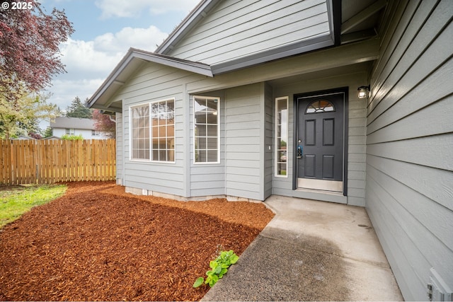 doorway to property with fence