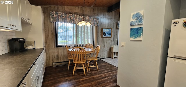 5840 Hacienda Ave, Lincoln City, OR 97367 - dining area featuring wooden walls, dark wood-type flooring, wooden ceiling, and vaulted ceiling