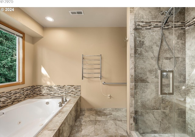 bathroom with separate shower and tub and radiator