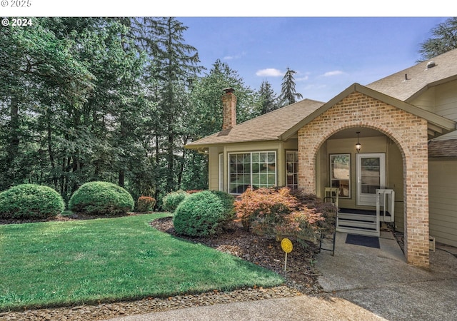 exterior space with a lawn and a porch