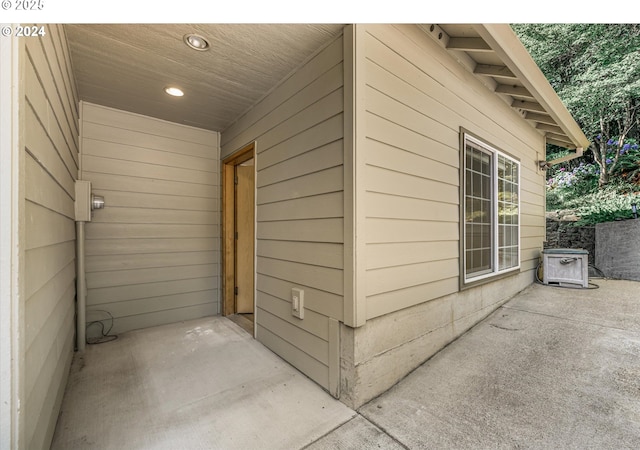 view of property exterior with a patio area