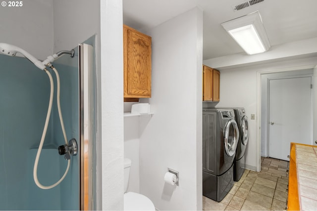 laundry room featuring washer and clothes dryer