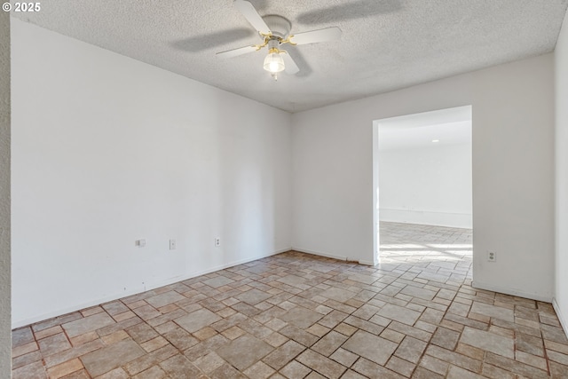 unfurnished room with a textured ceiling and ceiling fan