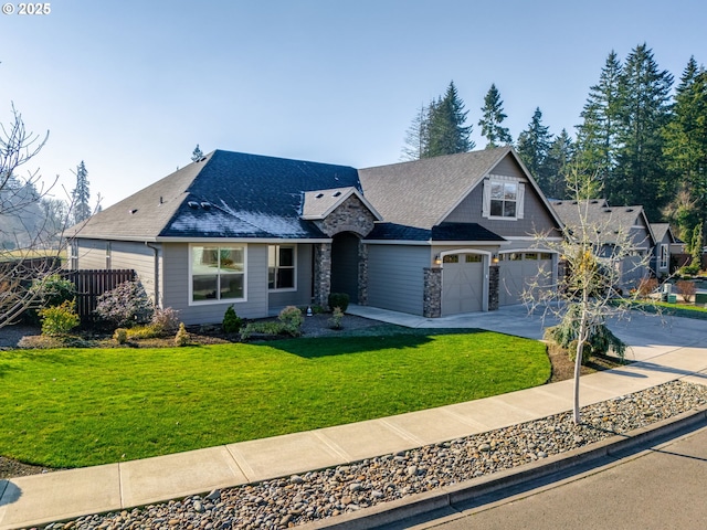 view of front facade featuring a garage and a front lawn