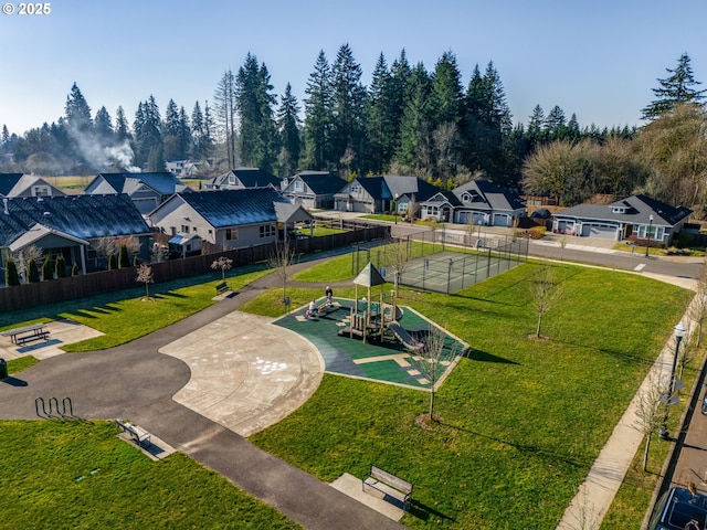 view of home's community with a playground and a lawn