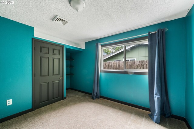 567 NW Cedar Ct, Warrenton, OR 97146 - empty room with carpet flooring and a textured ceiling