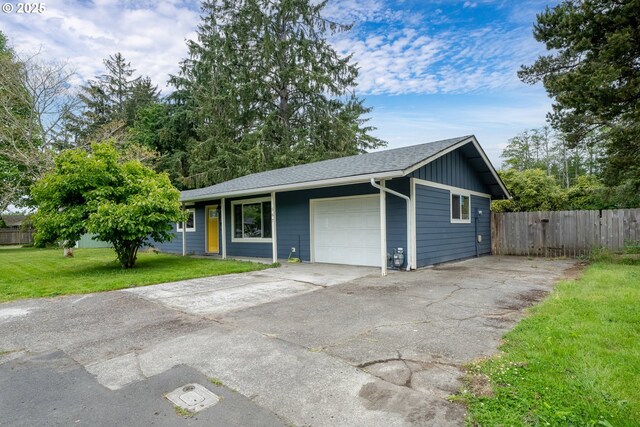 567 NW Cedar Ct, Warrenton, OR 97146 - view of front of home featuring a garage, concrete driveway, and a shingled roof