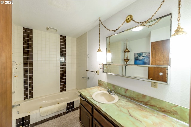 bathroom with vanity and a textured ceiling