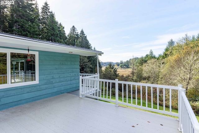 wooden balcony featuring a deck