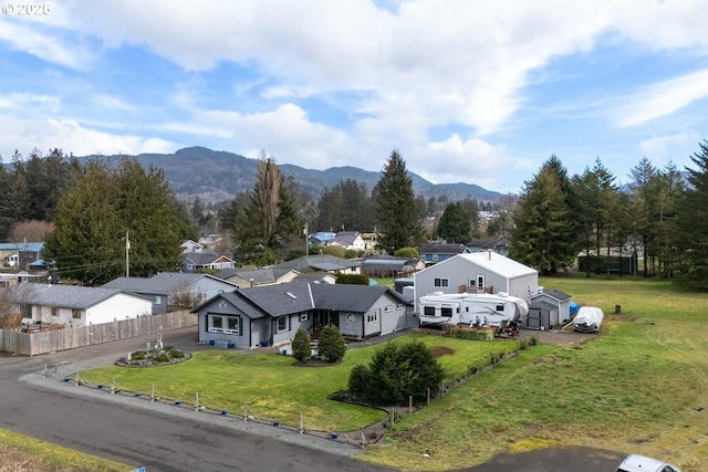 drone / aerial view featuring a mountain view and a residential view