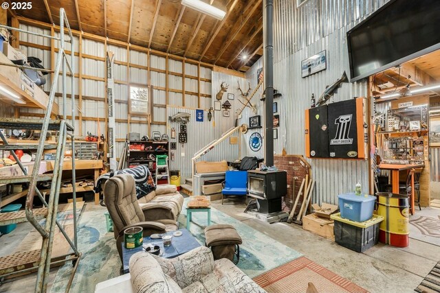 7655 Elliott St, Bay City, OR 97107 - garage featuring metal wall and a workshop area