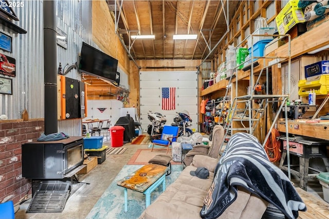 7655 Elliott St, Bay City, OR 97107 - garage featuring a wood stove