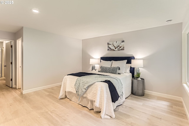7573 N Edgewater Ave, Portland, OR 97203 - bedroom with light wood-style flooring, baseboards, and recessed lighting