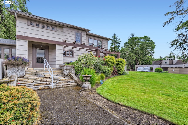 7573 N Edgewater Ave, Portland, OR 97203 - view of front of home featuring a front yard and a pergola