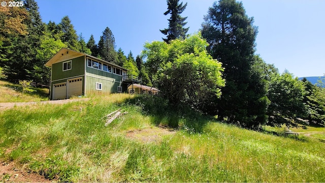 48495 Mcfarland Rd, Oakridge, OR 97463 - view of yard featuring an attached garage