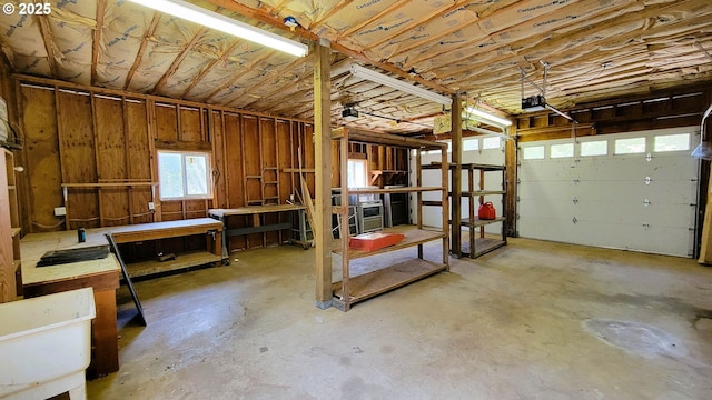 48495 Mcfarland Rd, Oakridge, OR 97463 - garage featuring a workshop area and a garage door opener