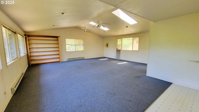 48495 Mcfarland Rd, Oakridge, OR 97463 - unfurnished room featuring baseboard heating, a baseboard radiator, a skylight, vaulted ceiling, and a ceiling fan