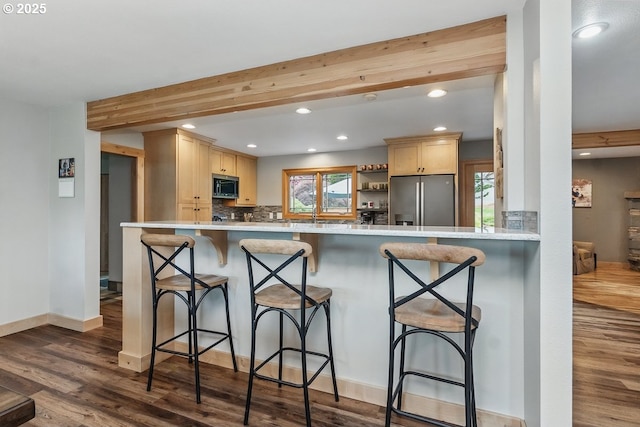 24601 SW 65th Ave, Tualatin, OR 97062 - kitchen with stainless steel appliances, light brown cabinets, recessed lighting, dark wood-style floors, and light countertops