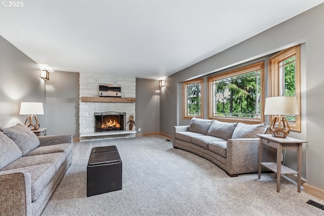 24601 SW 65th Ave, Tualatin, OR 97062 - carpeted living room featuring baseboards and a fireplace
