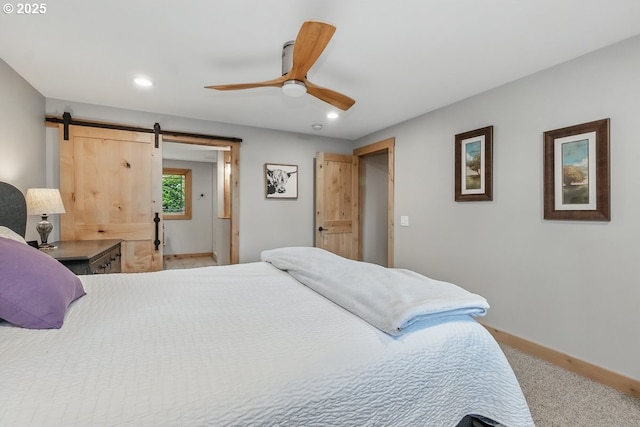 24601 SW 65th Ave, Tualatin, OR 97062 - carpeted bedroom featuring recessed lighting, baseboards, a barn door, and ceiling fan