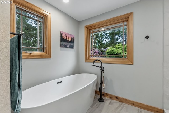 24601 SW 65th Ave, Tualatin, OR 97062 - full bath featuring plenty of natural light, a soaking tub, and baseboards