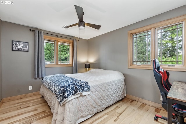 24601 SW 65th Ave, Tualatin, OR 97062 - bedroom featuring wood finished floors, baseboards, a desk, and ceiling fan