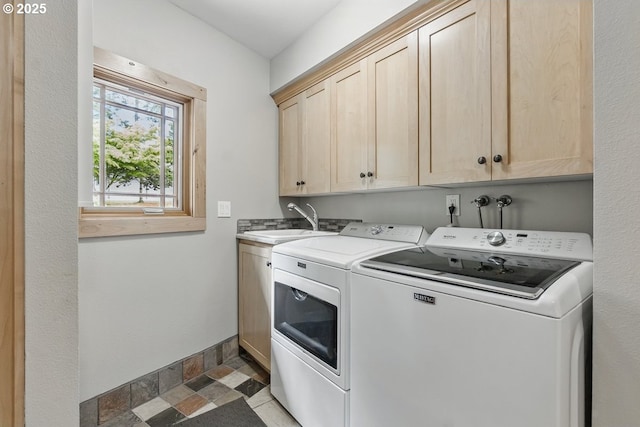 24601 SW 65th Ave, Tualatin, OR 97062 - washroom with washing machine and clothes dryer, cabinet space, light stone finish floors, and baseboards