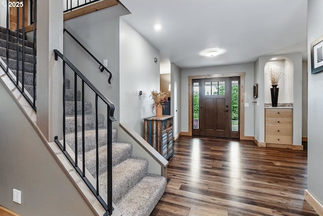 24601 SW 65th Ave, Tualatin, OR 97062 - entryway with wood finished floors, baseboards, stairs, arched walkways, and recessed lighting