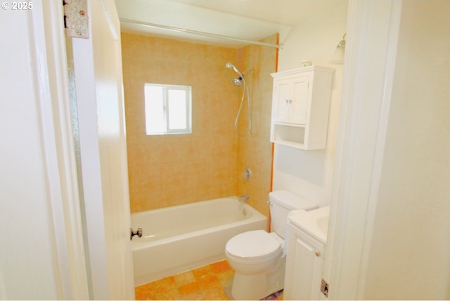 bathroom with tub / shower combination, vanity, and toilet