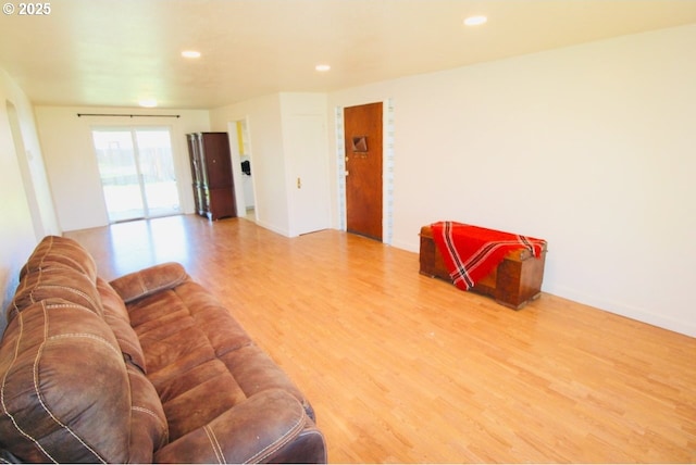 living room with wood finished floors and recessed lighting
