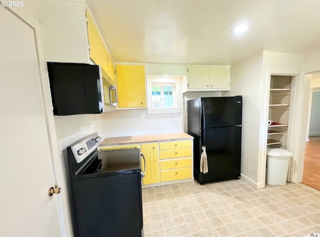 kitchen with light floors, stainless steel appliances, and light countertops