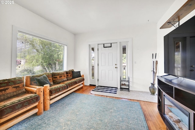 803 Main St, Philomath, OR 97370 - living area with healthy amount of natural light, wood-type flooring, and baseboards