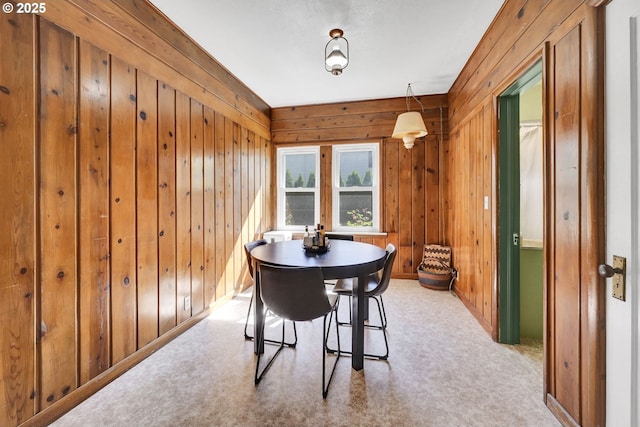 803 Main St, Philomath, OR 97370 - dining space with wooden walls and light carpet